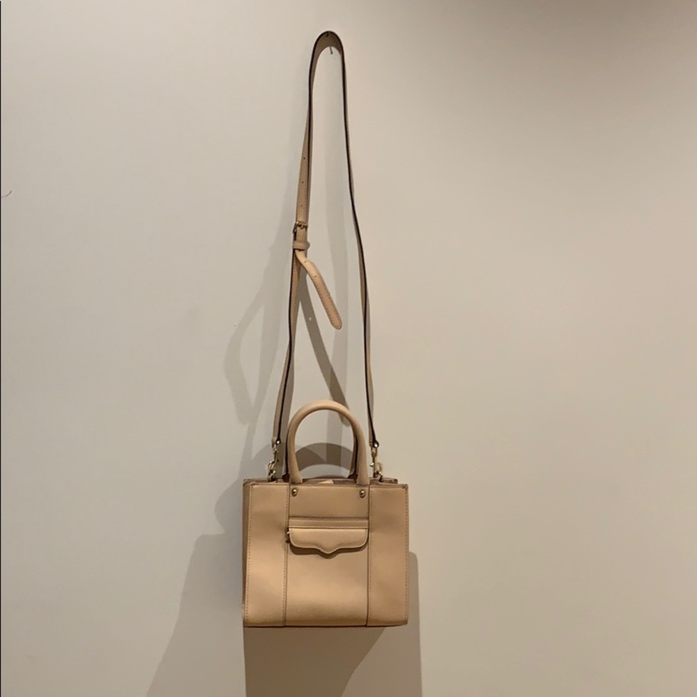 Chic, beige small Rebecca Miskoff crossbody bag.